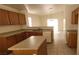 Traditional kitchen with a large island and neutral countertops, creating a functional workspace at 1013 Adobe Flat Dr, Henderson, NV 89011