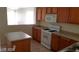Well-lit kitchen with white appliances and ample counter space at 1013 Adobe Flat Dr, Henderson, NV 89011