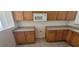 Kitchen with wooden cabinets and tile floors at 1013 Adobe Flat Dr, Henderson, NV 89011