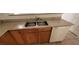 Traditional kitchen sink with neutral countertops and wood cabinets providing ample storage and a dishwasher at 1013 Adobe Flat Dr, Henderson, NV 89011