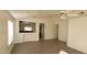 Living room with wood-look floors and kitchen view at 1013 Adobe Flat Dr, Henderson, NV 89011