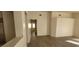 Bright living room with new gray flooring and fresh white paint at 1013 Adobe Flat Dr, Henderson, NV 89011