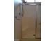 A shower that has glass doors and a towel rack above a seat at 1013 Adobe Flat Dr, Henderson, NV 89011
