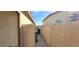 Image shows side yard with trash containers and access gate at 1013 Adobe Flat Dr, Henderson, NV 89011