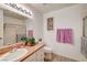 Bathroom featuring a well-lit vanity, sink, and a shower/tub with glass doors at 2725 S Nellis Blvd # 2108, Las Vegas, NV 89121