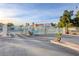 Gated community entrance featuring decorative metal gates, mature trees, and well maintained landscaping at 2725 S Nellis Blvd # 2108, Las Vegas, NV 89121