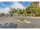 Gated community entrance with mature landscaping and palm trees on a sunny day at 2725 S Nellis Blvd # 2108, Las Vegas, NV 89121