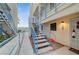 Charming apartment entrance with blue railings, outdoor lighting, and welcoming walkway at 2725 S Nellis Blvd # 2108, Las Vegas, NV 89121