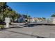 Community entrance with signage, trees, and gated access, providing security at 2725 S Nellis Blvd # 2108, Las Vegas, NV 89121