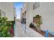 Exterior view of a condominium showcasing blue railings, walkways, and beautiful landscaping at 2725 S Nellis Blvd # 2108, Las Vegas, NV 89121