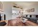 Open-concept living room with hardwood floors and a view into the kitchen at 2725 S Nellis Blvd # 2108, Las Vegas, NV 89121