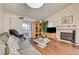 Cozy living room featuring a fireplace, wood floors, and a sliding glass door at 2725 S Nellis Blvd # 2108, Las Vegas, NV 89121