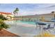 Large community pool surrounded by lounge chairs and landscaping, creating an inviting space for leisure and recreation at 2725 S Nellis Blvd # 2108, Las Vegas, NV 89121