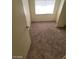 Simple carpeted bedroom with large window and closet at 6232 Blair Way, Las Vegas, NV 89107
