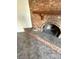 Traditional brick fireplace with a wooden mantel at 6232 Blair Way, Las Vegas, NV 89107