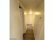 Clean hallway with wood-look flooring and access to rooms at 6232 Blair Way, Las Vegas, NV 89107