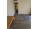 Living area with wood-look flooring and access to hallway at 6232 Blair Way, Las Vegas, NV 89107