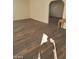 Bright living room with wood-look floors and archway at 6232 Blair Way, Las Vegas, NV 89107