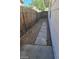 Side yard with a flagstone path and wooden fence at 6232 Blair Way, Las Vegas, NV 89107