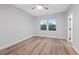 Bright bedroom with hardwood floors, neutral walls, and large windows at 2840 Soaring Peak Ave, Henderson, NV 89052