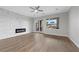 Bright living room with modern fireplace and sliding glass doors to a private outdoor area at 2840 Soaring Peak Ave, Henderson, NV 89052