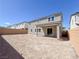 Spacious backyard with a covered patio and views of surrounding homes at 10208 Bismarck Palms Ave, Las Vegas, NV 89166