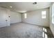 Spacious carpeted bedroom with multiple windows and recessed lighting at 10208 Bismarck Palms Ave, Las Vegas, NV 89166