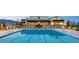 Resort-style community pool with lap lanes and plenty of lounge chairs at 10208 Bismarck Palms Ave, Las Vegas, NV 89166