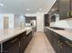 Spacious kitchen featuring a large island with a farmhouse sink and elegant gold hardware at 10208 Bismarck Palms Ave, Las Vegas, NV 89166