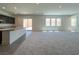 Bright open-concept living space with modern finishes and sliding doors to the backyard at 10208 Bismarck Palms Ave, Las Vegas, NV 89166