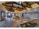 Expansive lobby area with high ceilings, wooden floors, modern lighting, and interactive display tables at 10208 Bismarck Palms Ave, Las Vegas, NV 89166