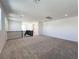 Spacious upstairs loft area with plush carpeting and natural light at 10208 Bismarck Palms Ave, Las Vegas, NV 89166