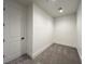 Compact walk-in closet with carpet and custom trim at 10208 Bismarck Palms Ave, Las Vegas, NV 89166