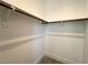 Organized walk-in closet with hanging rods and shelving at 10208 Bismarck Palms Ave, Las Vegas, NV 89166