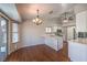 Charming dining area and kitchen with stainless steel appliances and bright white cabinets at 4357 Valley Regal Way, North Las Vegas, NV 89032