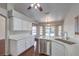 Eat in kitchen offers quartz countertops, stainless steel appliances, and white cabinetry at 4357 Valley Regal Way, North Las Vegas, NV 89032