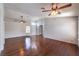 Expansive living area boasting hardwood floors, ceiling fans, natural light, and a welcoming atmosphere at 4357 Valley Regal Way, North Las Vegas, NV 89032