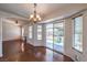 Open-concept living room with hardwood floors and a sliding glass door to the backyard at 4357 Valley Regal Way, North Las Vegas, NV 89032