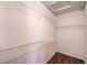 Walk-in closet features white wire shelving and wood floor at 4357 Valley Regal Way, North Las Vegas, NV 89032