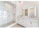 Bathroom with glass shower, double vanity, and modern fixtures at 655 Spotted Falcon St, Las Vegas, NV 89138