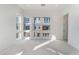 Well-lit bedroom with multiple windows and wall-to-wall carpet at 655 Spotted Falcon St, Las Vegas, NV 89138