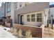 Contemporary home exterior with a brick wall and landscaping at 655 Spotted Falcon St, Las Vegas, NV 89138