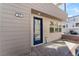 Modern home exterior with a blue door and gray siding at 655 Spotted Falcon St, Las Vegas, NV 89138
