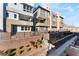 Modern townhome community with landscaped grounds and walkway at 655 Spotted Falcon St, Las Vegas, NV 89138