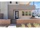 Private entrance with a modern blue door and brick walkway at 655 Spotted Falcon St, Las Vegas, NV 89138
