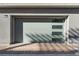 Attached garage with modern door and brick pavers at 655 Spotted Falcon St, Las Vegas, NV 89138