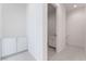 Bright hallway with a powder room and linen closet at 655 Spotted Falcon St, Las Vegas, NV 89138