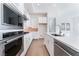 Sleek kitchen boasting stainless steel appliances and white cabinetry at 655 Spotted Falcon St, Las Vegas, NV 89138