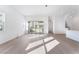 Open living area with hardwood floors and sliding glass doors leading to a patio at 655 Spotted Falcon St, Las Vegas, NV 89138