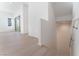Open living room with hardwood floors and access to a balcony at 655 Spotted Falcon St, Las Vegas, NV 89138